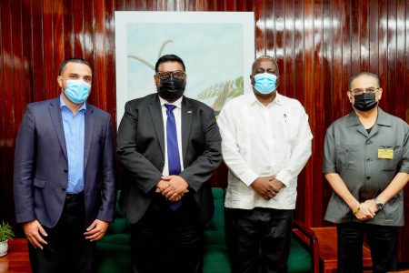 President Irfaan Ali (second from left) with Prime Minister Mark Phillips (second from right), Vishok Persaud (left) and Rakesh Puri. (Office of the President photo)