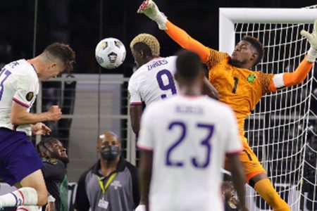 Jamaica goalkeeper Andre Blake misses his clearance as Matthew Hoppe (left) secures the winning header for United States.
