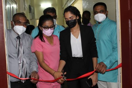 The ribbon being cut for the rehabilitated male ward