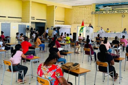 Education Minister at a cash grant distribution exercise at the Anna Regina Secondary last Wednesday (DPI photo) 