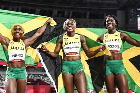 WORLD’s BEST! From left, Shericka Jackson, Elaine Thompson-Herah and Shelly-Ann Fraser Pryce after their domination of the women’s 100m final in Tokyo, Japan yesterday.
