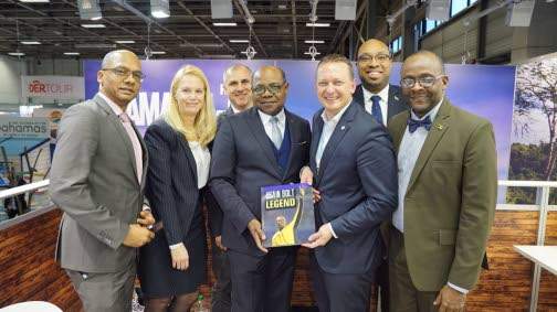 Tourism Minister Edmund Bartlett (centre) in March 2018 presenting a copy of the Usain Bolt Legend book to Germany's AIDA Cruises President Felix Eichhorn at the Jamaica booth of the ITB global tourism tradeshow in Berlin, Germany. He is flanked by (from right) JTB continental Europe head, Gregory Shervington; Michaela Gruun, senior marketing anager, DACH; Dennis Schrahe, vice-president, AIDA Cruises; Senior Advisor/Strategist, Delano Seiveright; and JTB head, Donovan White. 
