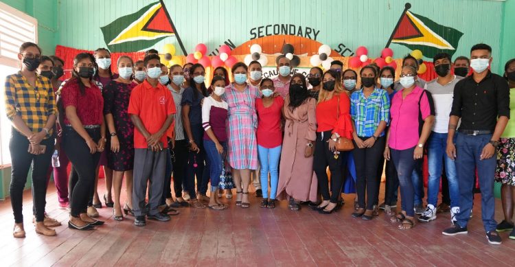 Education Minister Priya Manickchand posing with headteachers and teachers who participated in Saturday’s distribution exercise at the Leguan Secondary School. (Ministry of Education photo)