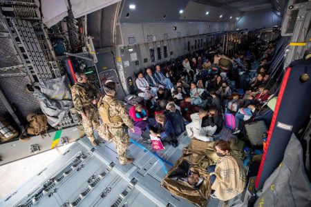 A handout photo obtained from Twitter via @Bw_Einsatz on August 17, 2021 shows evacuees from Afghanistan as they arrive in an Airbus A400 transport aircraft of the German Air Force Luftwaffe in Tashkent, Uzbekistan. Marc Tessensohn/Twitter
