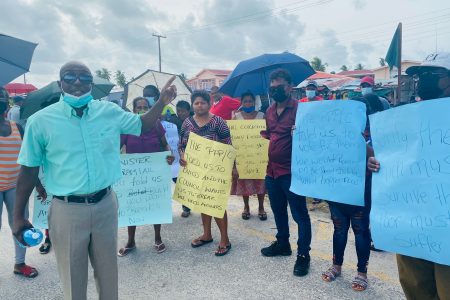 PNCR Region Two Chairman Prince Holder (at left) along with some of the protesting vendors