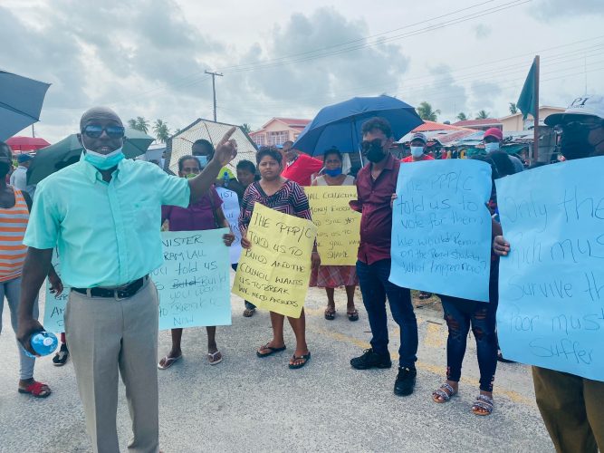 PNCR Region Two Chairman Prince Holder (at left) along with some of the protesting vendors