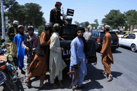 Taliban forces patrol a street in Herat, Afghanistan on Saturday (REUTERS/Stringer)