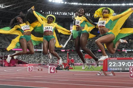 Jamaica’s [from left to right] Elaine Thompson, Shelly-Ann Fraser-Pryce, Shericka Jackson and Briana Williams in celebratory mood after comfortably winning the Women’s 4x100m Gold.

