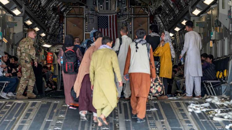 Evacuees board a C-17 Globemaster III aircraft at Hamid Karzai International Airport in Kabul (Reuters)