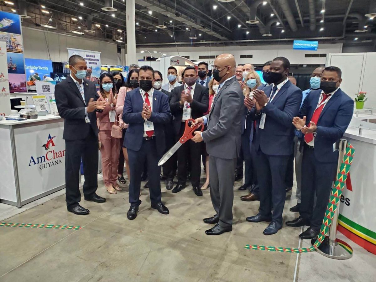 Vice President Bharrat Jagdeo (centre) cutting the ribbon at one of the events in the presence of other members of the Guyana team