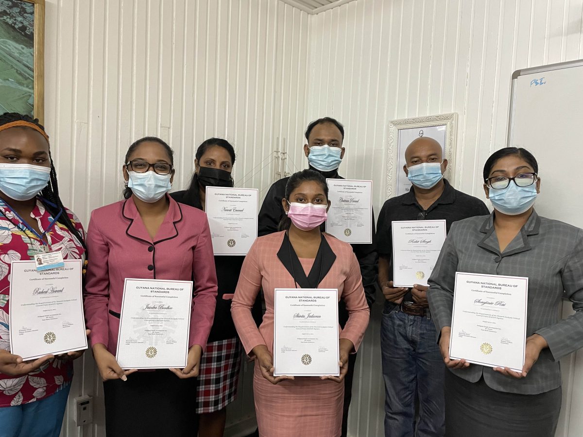 Employees of PSI with their certificates. From left are Rachael Howard – Food Safety Officer, Jasodra Boodhoo – Finance Controller, Narwati Emanuel – Senior Clerk Warehouse, Shivita Jaikarran – Senior Quality Control Manager Secretary, Chaitram Persaud – Marketing officer, Rohit Singh – Deputy Quality Control Manager, and Sorojinie Rai – Head of Department Shipping & Logistics 