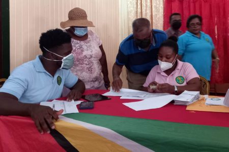 Staff of the Ministry of Agriculture verifying the data before issuing the grants (DPI photo) 