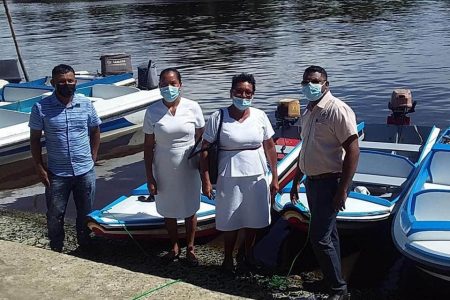 Kabakaburi health centre workers receiving their boat from the Regional Health Officer Dr Ranjeev Singh 