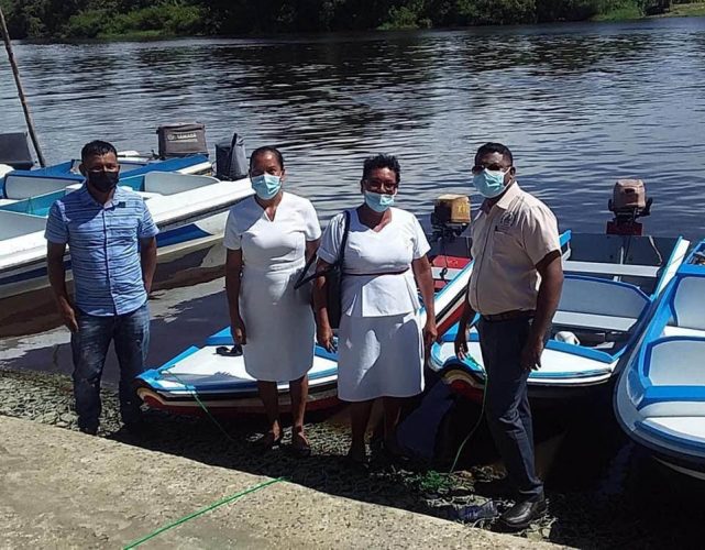 Kabakaburi health centre workers receiving their boat from the Regional Health Officer Dr Ranjeev Singh 