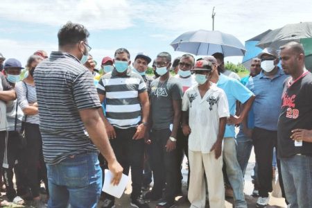 The tractor operators yesterday meeting with an engineer before further discussions on payment.