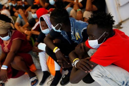 Migrants wait to be medically examined on board the German NGO migrant rescue ship Sea-Watch 3 after it arrived with 257 rescued migrants on board in Trapani on the island of Sicily, Italy August 7, 2021. (REUTERS/Darrin Zammit Lupi photo)