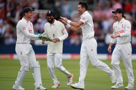 England’s James Anderson celebrates the wicket of India’s Ajinkya Rahane with teammates. Images via Reuters/Paul Childs.