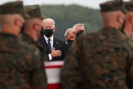 US President Joe Biden salutes during the dignified transfer of the remains of US Military service members who were killed by a suicide bombing at the Hamid Karzai International Airport. Credit: Reuters photo