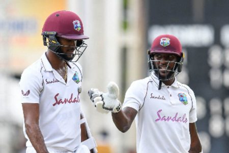 Vice-captain Jermaine Blackwood (right) makes a point to captain Kraigg Brathwaite as they leave the field at lunch on day two of the first Test against Pakistan
