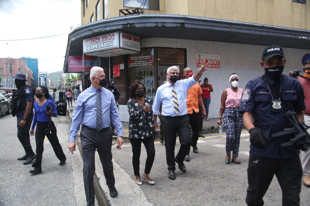 Port-of-Spain Mayor Joel Martinez, Trade Minister Paula Gopee-Scoon and DOMA president Gregory Aboud during a walkabout on the first day of the retail sector’s reopening along Frederick Street, Port-of-Spain, yesterday.