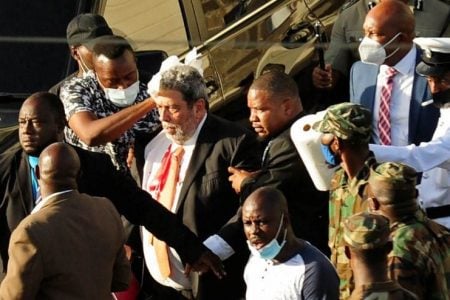 Prime Minister Ralph Gonsalves (centre) being tended to after the attack
Photo: REUTERS/Robertson S. Henry
