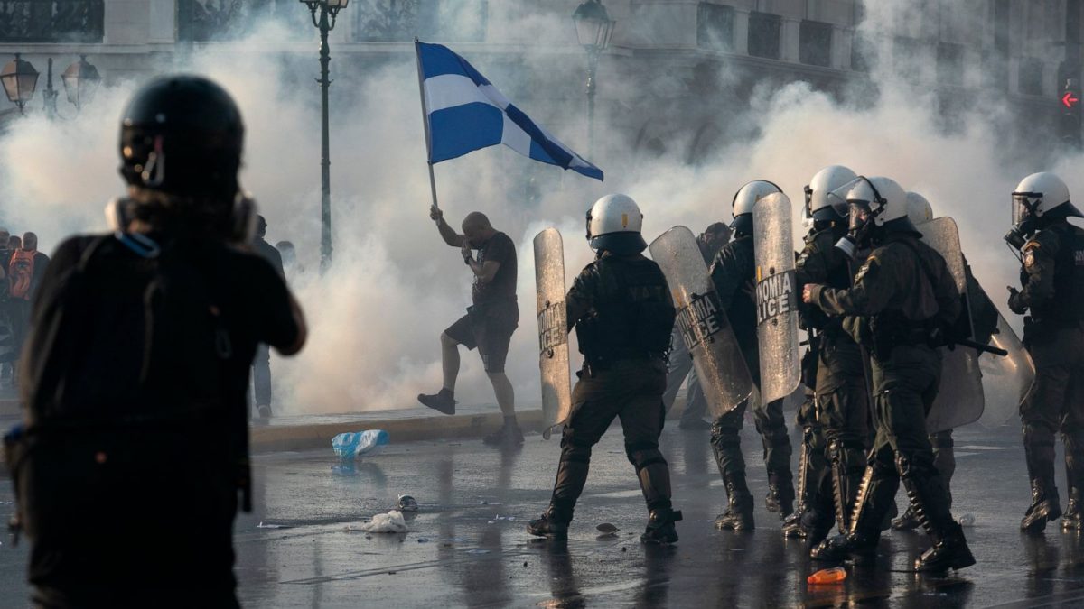 Greek police use tear gas to disperse anti-vaccine protesters during a rally at Syntagma square  (AP photo)