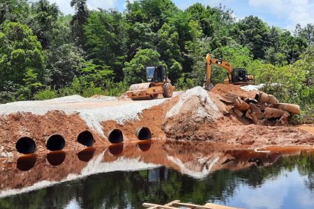 The installed culverts at the section of the road that had been washed away