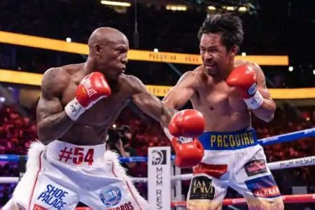 Manny Pacquiao, right on the attack against Yordenis Ugas. (Photo courtesy Fightnews.com)