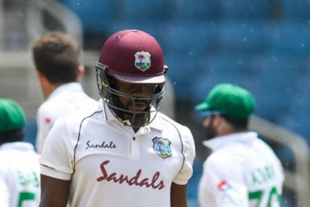 Batsman Kyle Mayers walks off after falling for 32 on Tuesday’s final day of the second Test at Sabina Park.