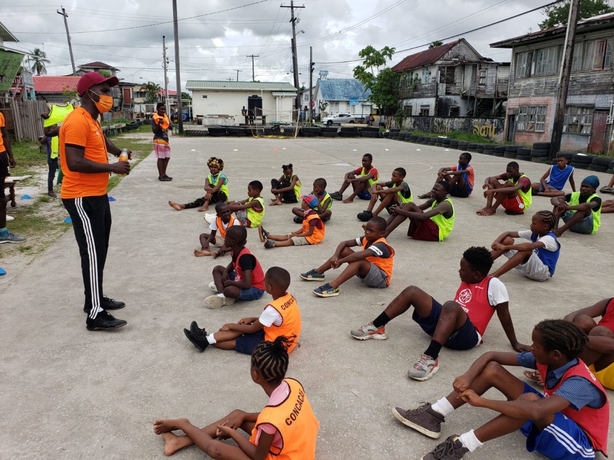 Coach of VMFA and former resident of the Albouystown community Delon Williams addressing a small section of the participants