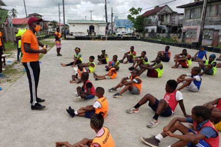 Coach of VMFA and former resident of the Albouystown community Delon Williams addressing a small section of the participants