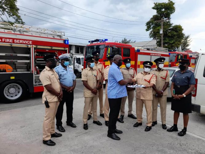 Minister of Home Affairs Robeson Benn hands over the keys for the new fire tenders to Fire Chief (Ag) Kalamadeen Edoo (Ministry of Home Affairs photo)