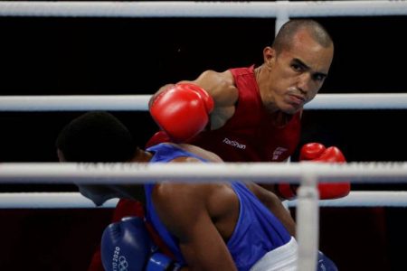 Eldric Sella Rodriguez of the Refugee Olympic Team in action against Euri Cedeno Martinez of the Dominican Republic REUTERS/Ueslei Marcelino/File Photo.