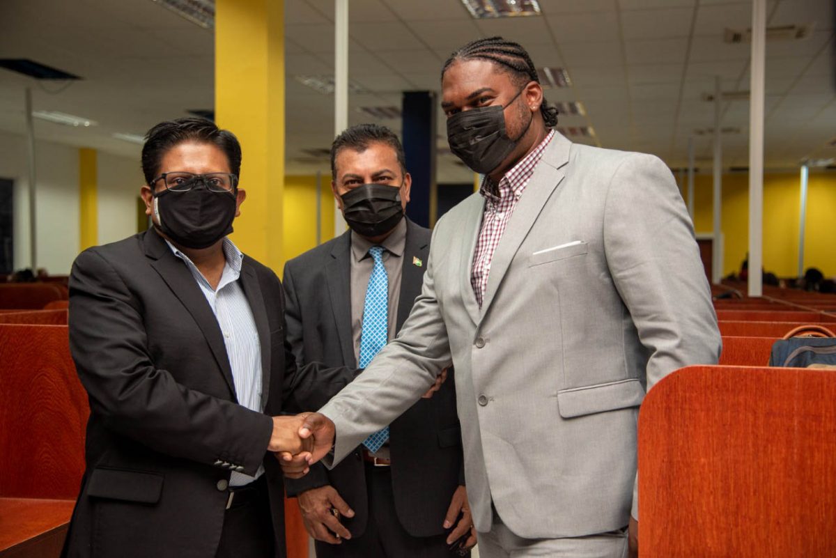 Malcolm Sobers, the Chief Executive Officer of Midas BPO Inc (right) greeting Minister Ashni Singh. At centre is the head of GO-Invest Peter Ramsaroop.