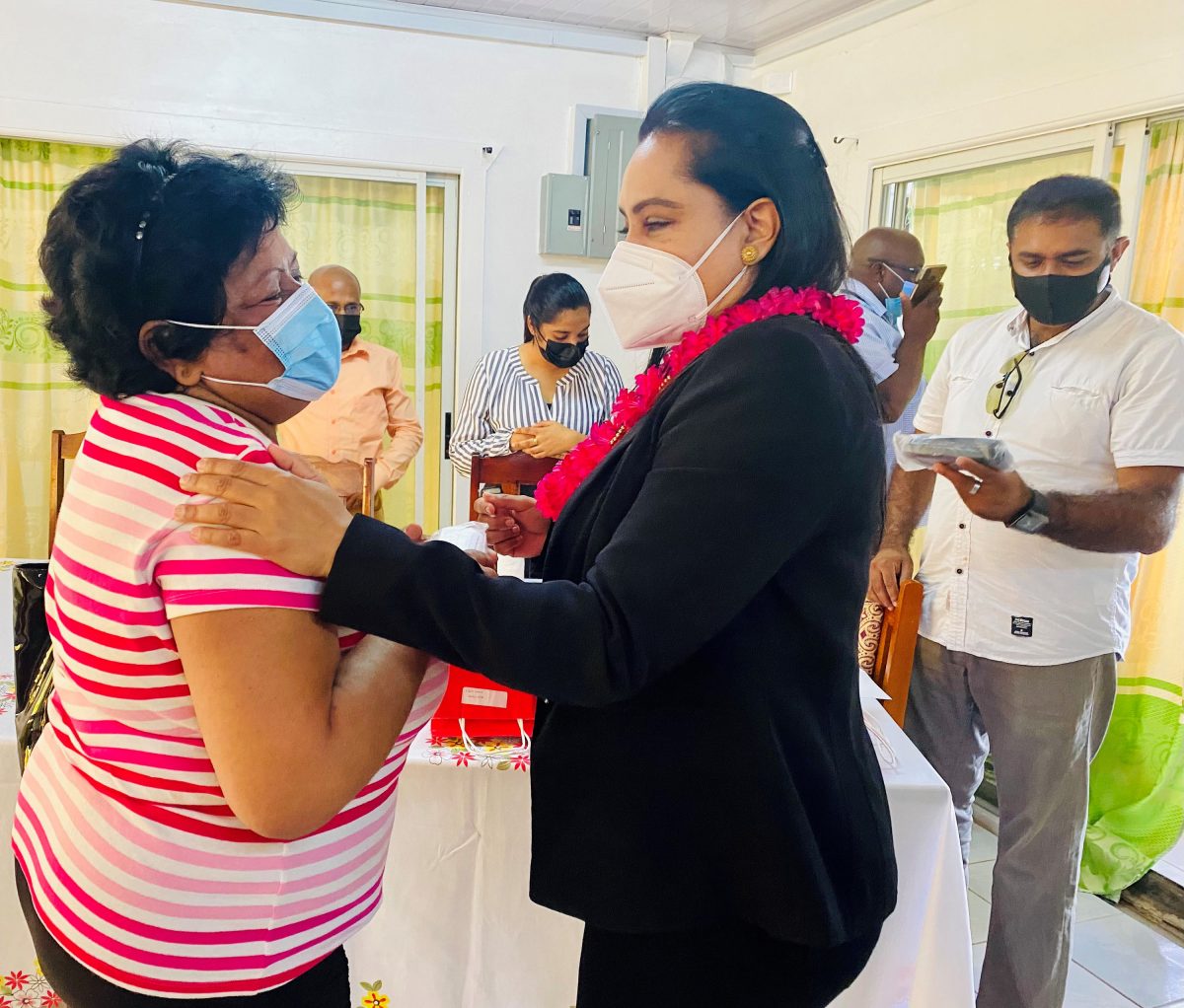 Minister of Human Services and Social Security Dr. Vindhya Persaud (right) speaking with Surujnandanie Singh. 