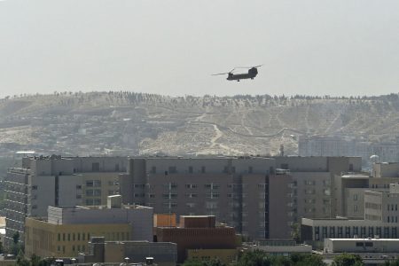 A US military helicopter flies above the US embassy in Kabul on August 15, 2021.  Wakil Kohsar/AFP/Getty Images