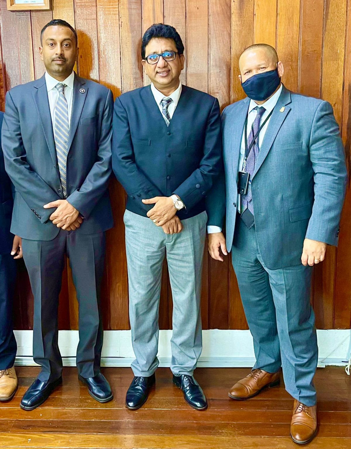 Attorney General Anil Nandlall (centre) with the US law enforcers (AG Chamber’s photo)
