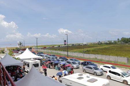 The line of vehicles yesterday with children for the Pfizer vaccine at MovieTowne. (Ministry of Health photo)