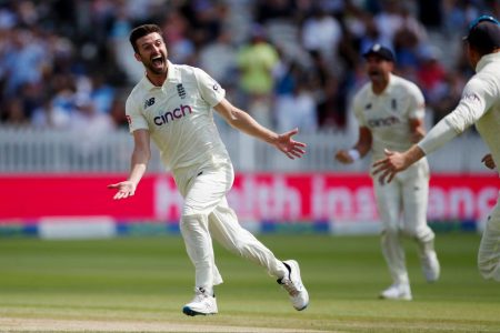 England’s Mark Wood celebrates after taking the wicket of India’s Rohit Sharma (not in picture) Action Images via Reuters/Paul Childs
