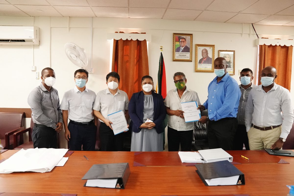 Minister of Education Priya Manickchand (fourth from left) and Permanent Secretary, Alfred King (third from right) along with the contractors. (Ministry of Education photo)
