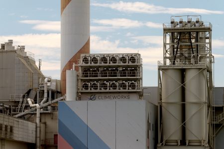 FILE PHOTO: A facility for capturing CO2 from air of Swiss Climeworks AG is placed on the roof of a waste incinerating plant in Hinwil, Switzerland July 18, 2017. REUTERS/Arnd Wiegmann/File Photo