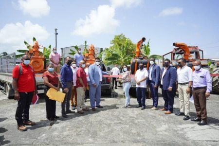 President Irfaan Ali handing over the boom sprayers for farmers in Region Two. Also in photo are other members of the Cabinet and Regional Vice Chairman Humace Oodit.
