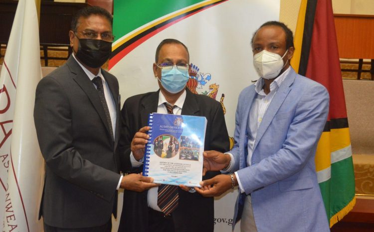 Auditor General Deodat Sharma (centre), submitting the 2020 Audit Report to Speaker Manzoor Nadir (left) and Chairman of the Public Accounts Committee Jermaine Figueira. 