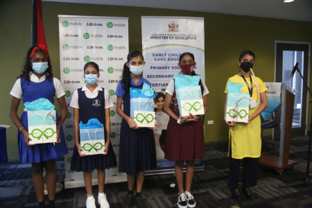 Students tied for third place in the SEA exam, from left, Leeann James, Anya Ali, Isharra Sookdeo, Ravenna Baldeo and Aishani Ramsewak pose for a picture after receiving packages at the SEA Awards ceremony at the Ministry of Education, Port-of-Spain, yesterday.