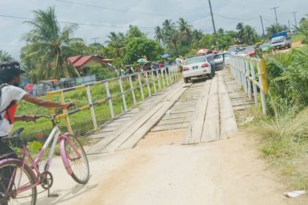 Residents and vehicles that were blocked from entering the village during the protest