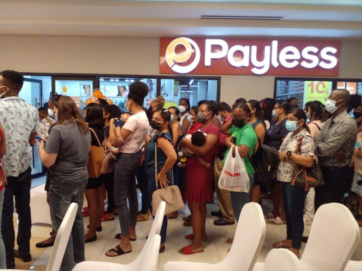 Customers waiting in line to be a part of the first 50 to receive a $4,000 gift voucher to enhance their shopping experience