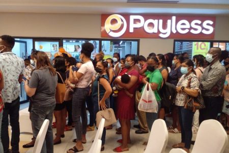 Customers waiting in line to be a part of the first 50 to receive a $4,000 gift voucher to enhance their shopping experience