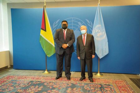 President Irfaan Ali (left) with UN Secretary General António Guterres at the UN Headquarters in New York yesterday. A release from the Office of the President said that the two discussed matters in relation to climate change and Covid-19 vaccines. 