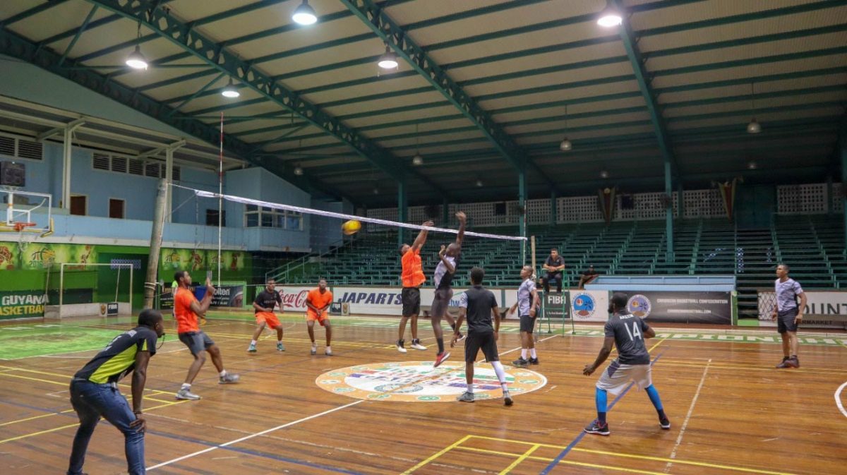 Scene from the Eagles (right) and Young Achievers clash in the DVA ‘A’ League on Friday at the Cliff Anderson Sports Hall, Homestretch Avenue.