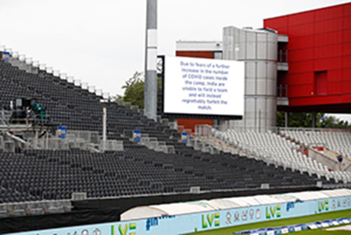 A message is seen displayed on a big screen after the match was cancelled due to members of the India staff contracting COVID-19 Action Images via Reuters/Jason Cairnduff
